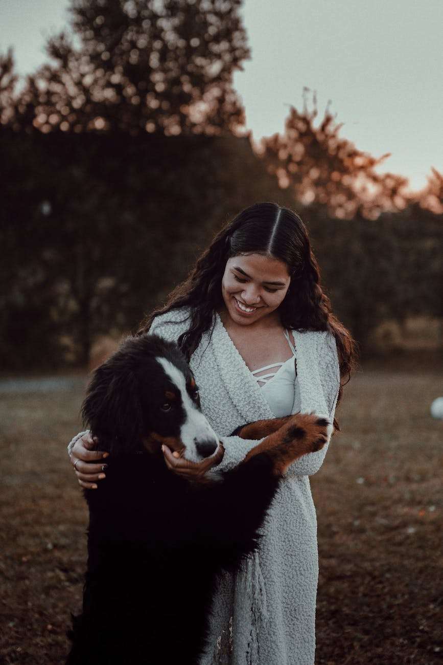 Is a Grain-Free Diet for Dogs Healthier? 11 woman petting dog